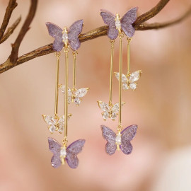 magnifiques Boucles d'oreilles papillon en cristal violet